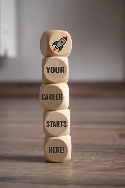 Cubes dice with start your career here on wooden background