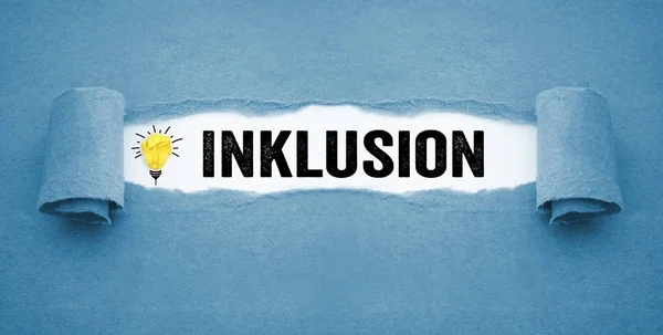 Paper work with lightbulb and the german word for inclusion - Inklusion