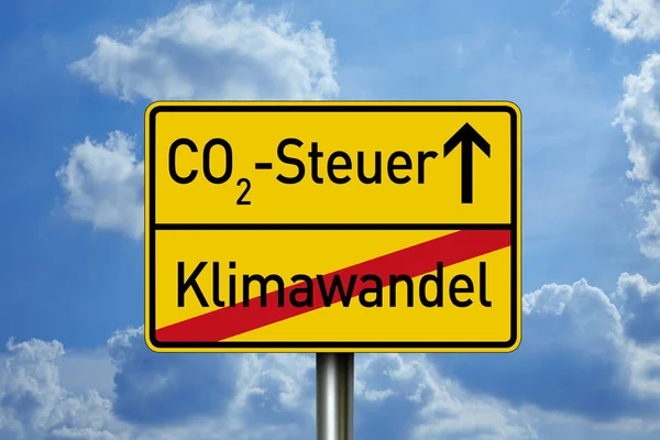 Traffic sign with climate protection, co2 emission and co2 tax with clouds in the background