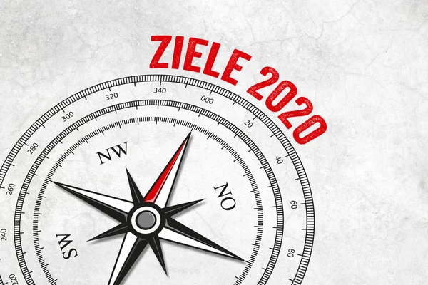 Compass with compass needle and goals - ziele 2020 on marble background