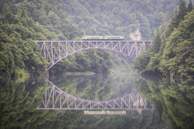Tadami railway line and Tadami River in summer season at Fukushima prefecture. clipart