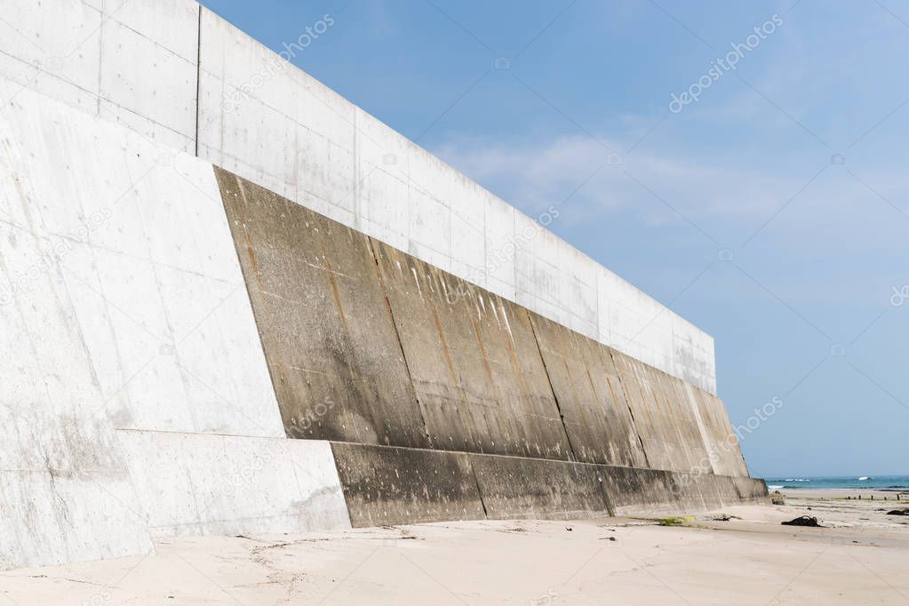 High concrete wall at seaside for protect tsunami big wave