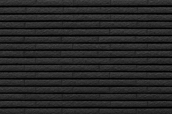 黒の石レンガ タイル壁面パターンと背景 — ストック写真