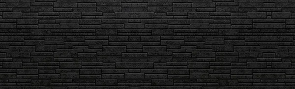 黒い石の壁の背景のパノラマ — ストック写真