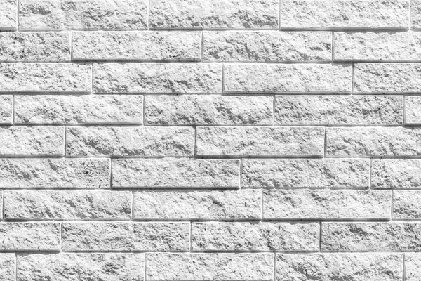 白い石造りのブロック壁パターンとシームレスな背景 — ストック写真
