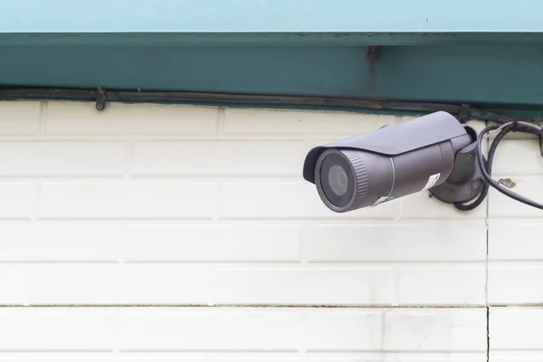 Video camera security system on wall of building