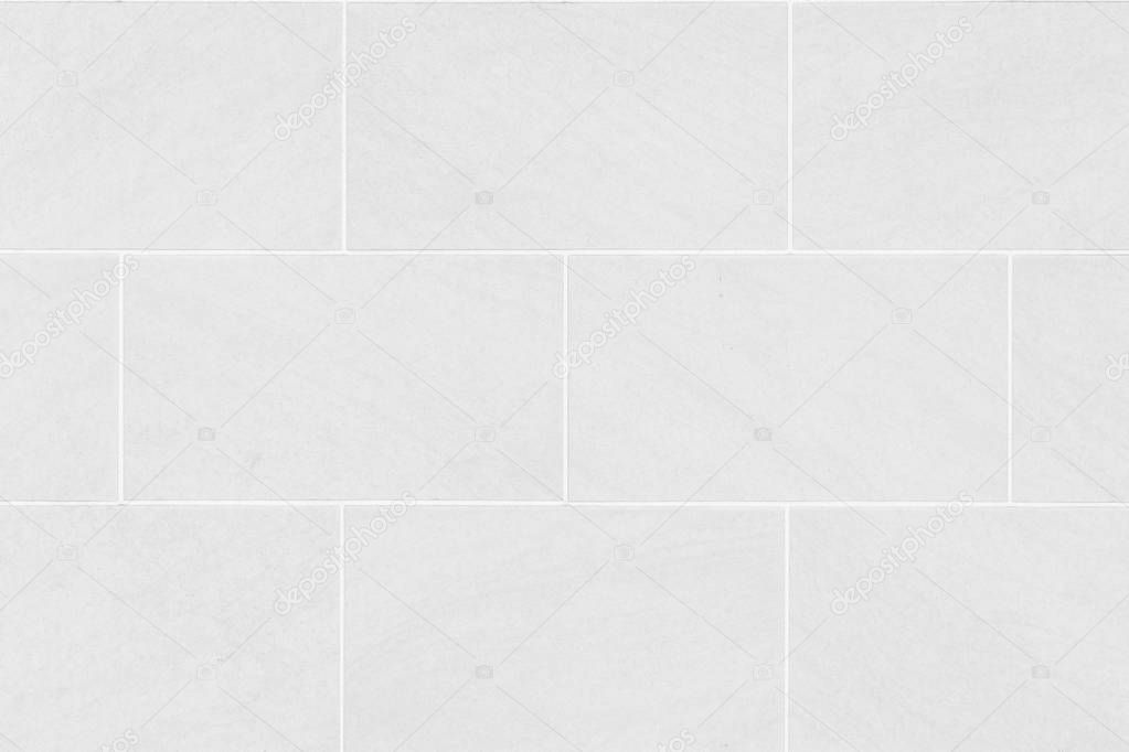 White stone wall tile seamless background and texture