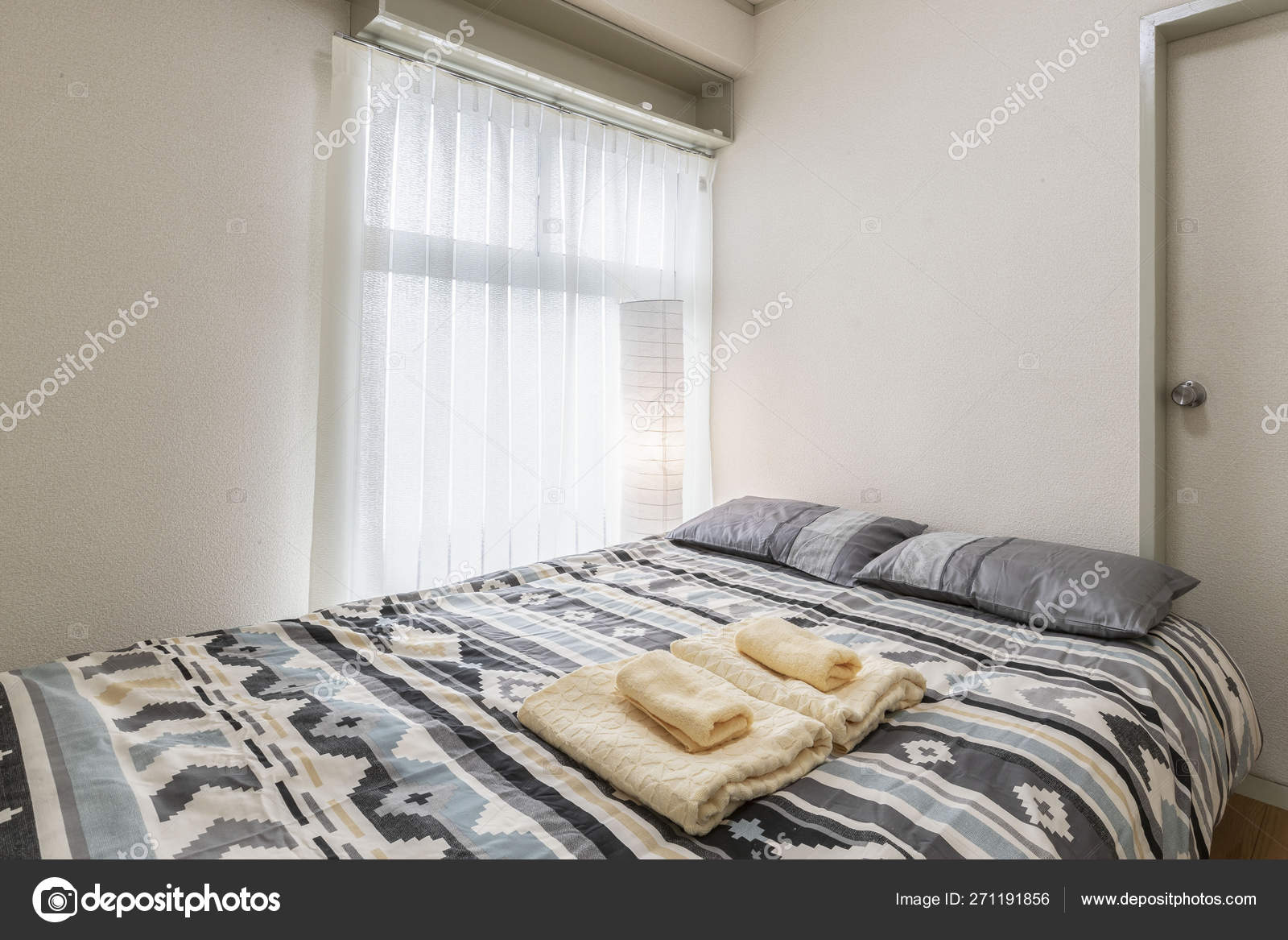 Queen Size Bed Small White Bedroom Stock Photo