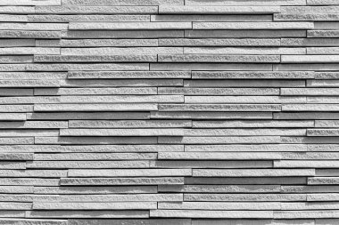 Arka plan ya da doku olarak taş duvar. Taş duvarın bir parçası, arka plan ya da doku için. Desen gri renk modern biçim tasarımı