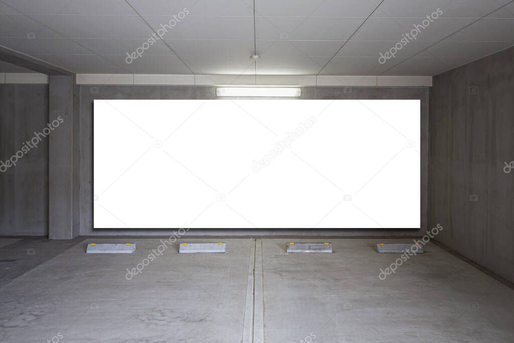 Parking garage underground interior with blank billboard