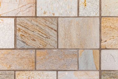 Granit kahverengi taş blok duvar deseni ve pürüzsüz arkaplan