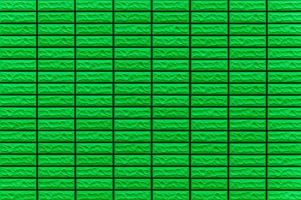 Modern pattern of green stone block wall tile texture and seamless background