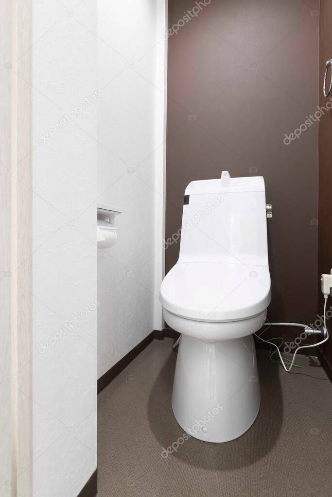 Modern automatic toilet In a small toilet in a wooden house