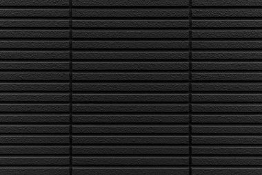 Çizgili ve pürüzsüz arkaplanı olan modern siyah taş duvar.