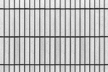 Çizgili ve pürüzsüz arkaplanı olan modern beyaz taş duvar