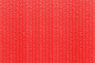 Çizgili ve pürüzsüz arkaplanı olan modern kırmızı taş duvar.