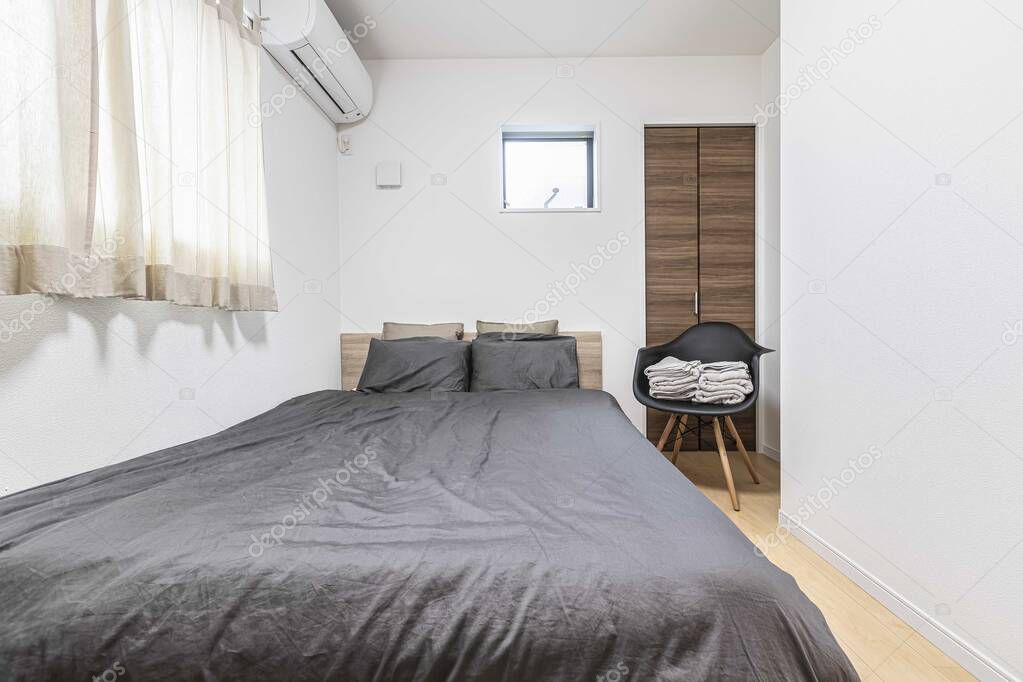 Single bed in modern small bedroom at apartment