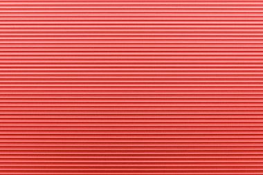 Küçük dalgalı desenli kırmızı çinko plaka ve pürüzsüz arkaplan