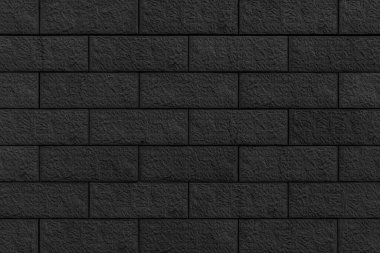 Siyah taş kaplama blok desenli panorama duvar döşeme dokusu ve pürüzsüz arkaplan