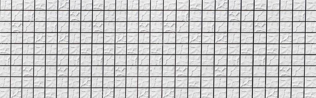 Panorama of White mosaic wall tile pattern and seamless background