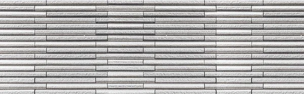 縞模様の質感とシームレスな背景と現代の白い石の壁のパノラマ — ストック写真