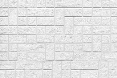 Çizgili ve pürüzsüz arkaplanı olan modern beyaz taş duvar