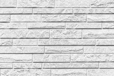 Çizgili ve pürüzsüz arkaplanı olan modern beyaz taş duvar
