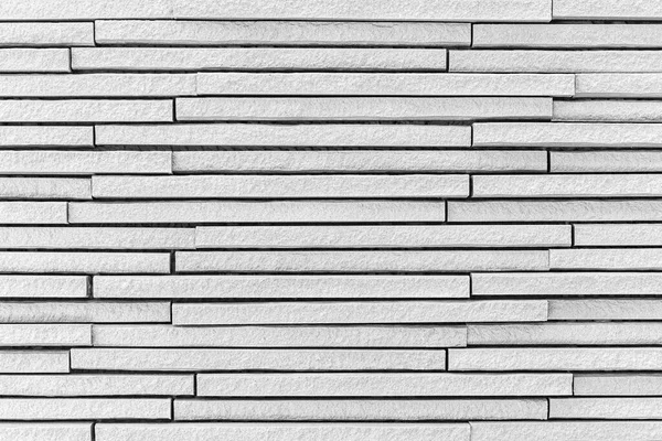 Block pattern of white stone cladding wall tile texture and seamless background