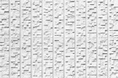 Çizgili ve pürüzsüz arkaplanı olan modern beyaz taş duvar