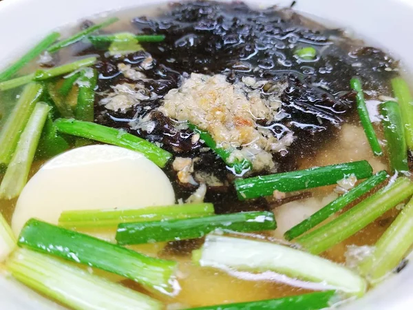 Clear soup with seaweed, soft tofu and minced pork