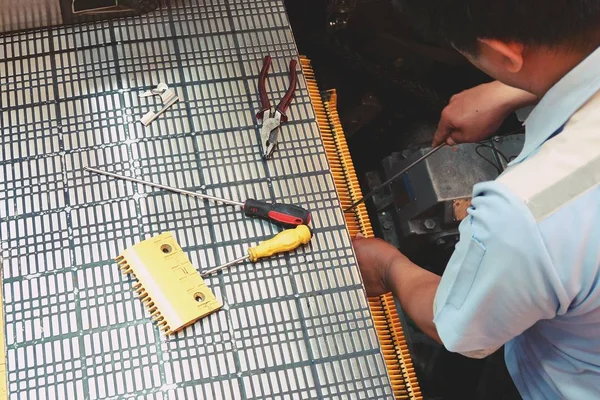 Technician fix the escalator at shopping mall