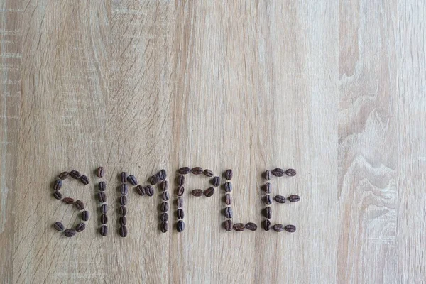simple text Made Of Coffee Beans. Simplicity Concept