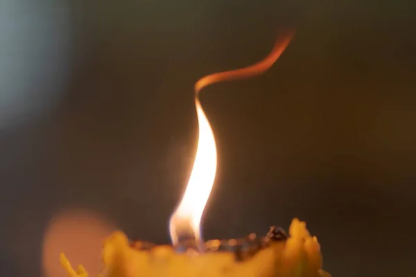 Close Light Burning Yellow Candle Black Background — Stock fotografie