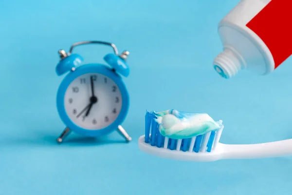 Healthy Teeth Toothbrush Toothpaste Bath Towel Alarm Clock Table Bathroom — Stock Photo, Image
