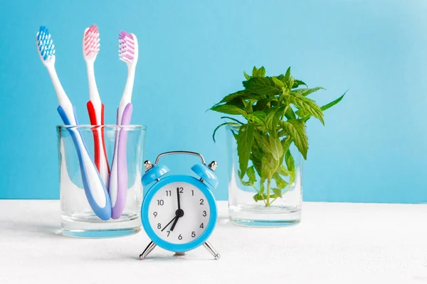 Healthy Teeth Toothbrushes Toothpaste Bath Towel Alarm Clock Table Bathroom — Stock Photo, Image