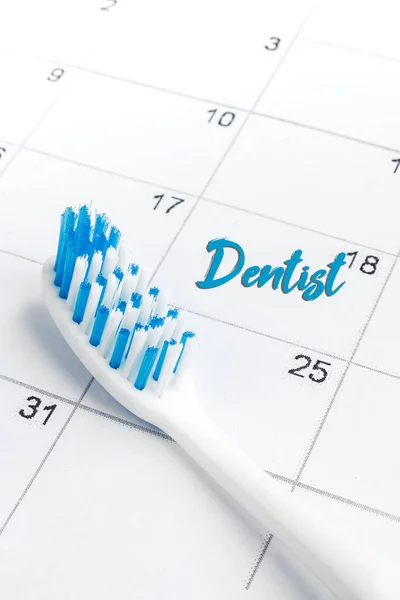 Dental health The appointment date of the dentist on the calendar with a toothbrush Personal care, health care, health hygiene