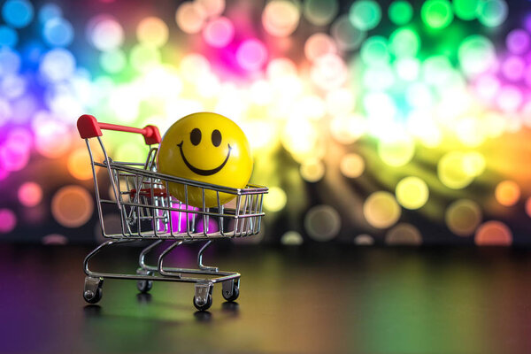 Smile in a shopping basket on a holiday background on April Fool's Day with text April Fool's Day, humor, joke
