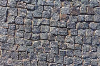 Taş kaldırım dokusu, granit cobblestoned kaldırım arka plan, Arnavut kaldırımlı taş yol düzenli şekilleri, eski kaldırım taşı kaldırım yakın çekim arka plan 