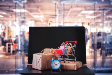 Online alışveriş / e-ticaret ve teslimat hizmeti kavramı: kağıt karton ile bir alışveriş sepeti veya logo üstünde a laptop klavye trolley, perakendeci siteler internet üzerinden gelen müşteriler sipariş şeyler gösteriyor