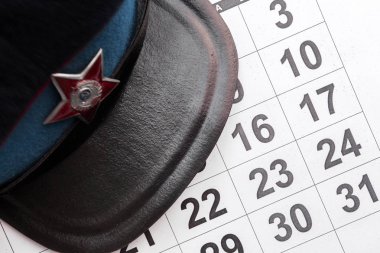 February 23, Defender of the Fatherland Day, holiday card. Military cap and calendar clipart