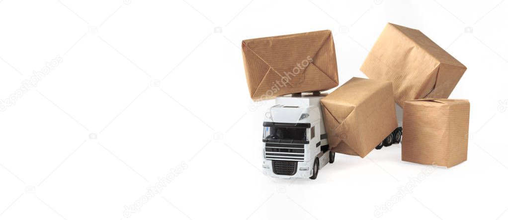 online shopping / e-commerce and delivery: paper boxes on a truck depict customers ordering goods from online retail sites, delivery, freight, on a white background