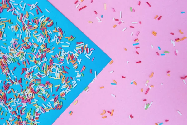 Multicolored confetti on  background top view