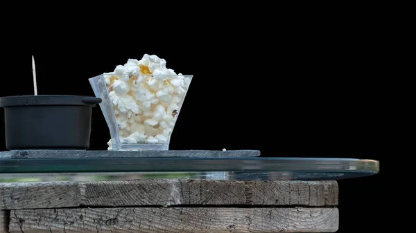 isolated popcorn appetizer at party on black background