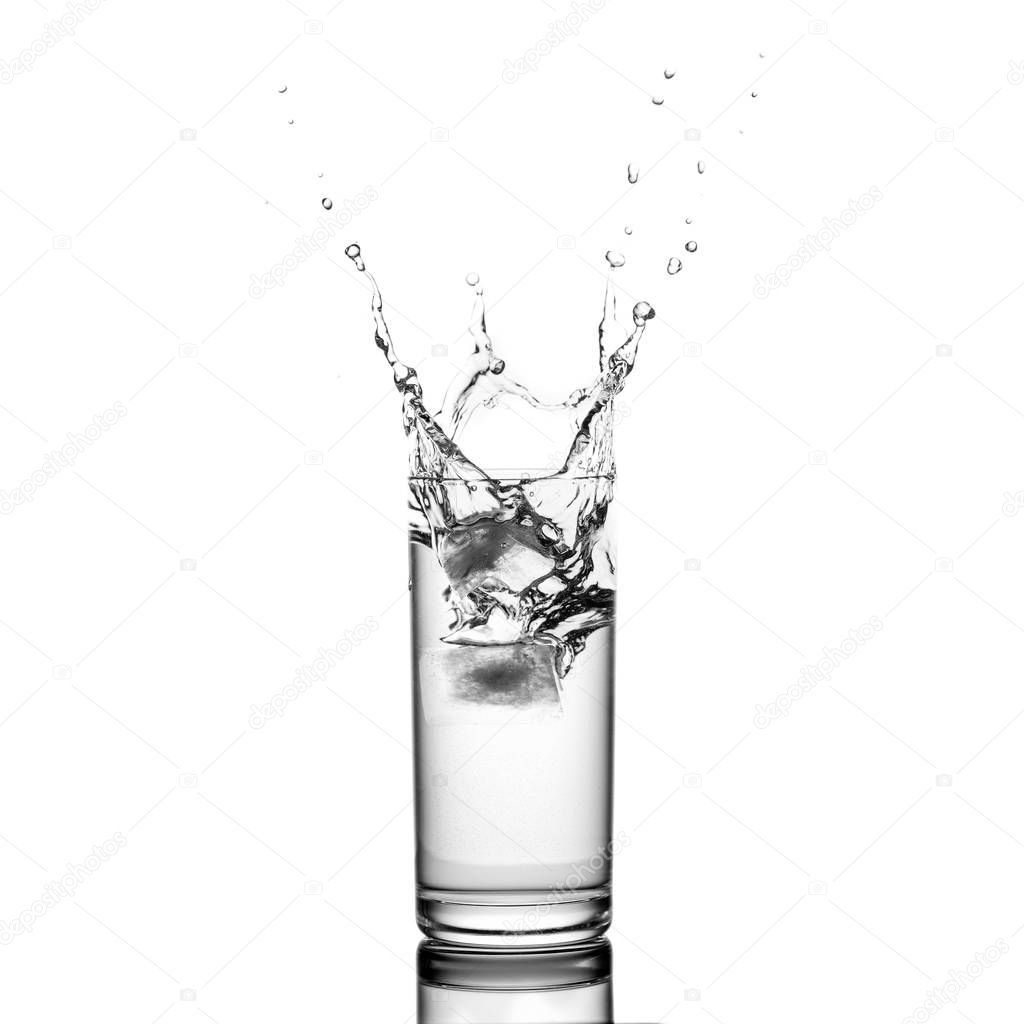 water splash in glass isolated on white background