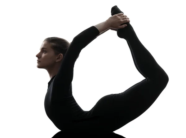 one caucasian woman  practicing gymnastic yoga  urdhva dhanurasana upward bow pose in silhouette   on white background