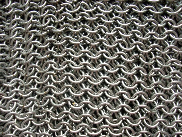 This is the texture of antique chain mail. Of course, its a hand-made article.