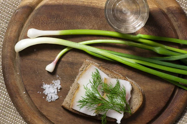 Sandwich with salted lard on rye bread and vodka view from above — Stock Image Sandwich Salted Lard Rye Bread Vodka View Royalty Free Stock Photos