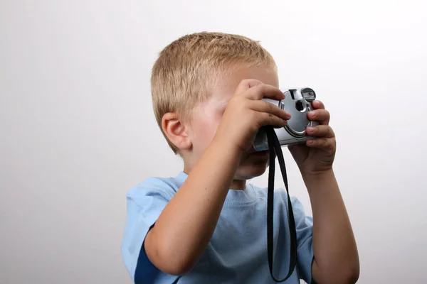 Shy Toddler Holding Silver Camera Looking His Object — Stock Fotó