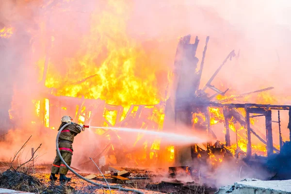 Fireman Extinguishes Fire Old Wooden House — Stock Photo, Image