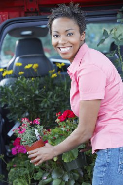 Woman Buying Potted Plants clipart